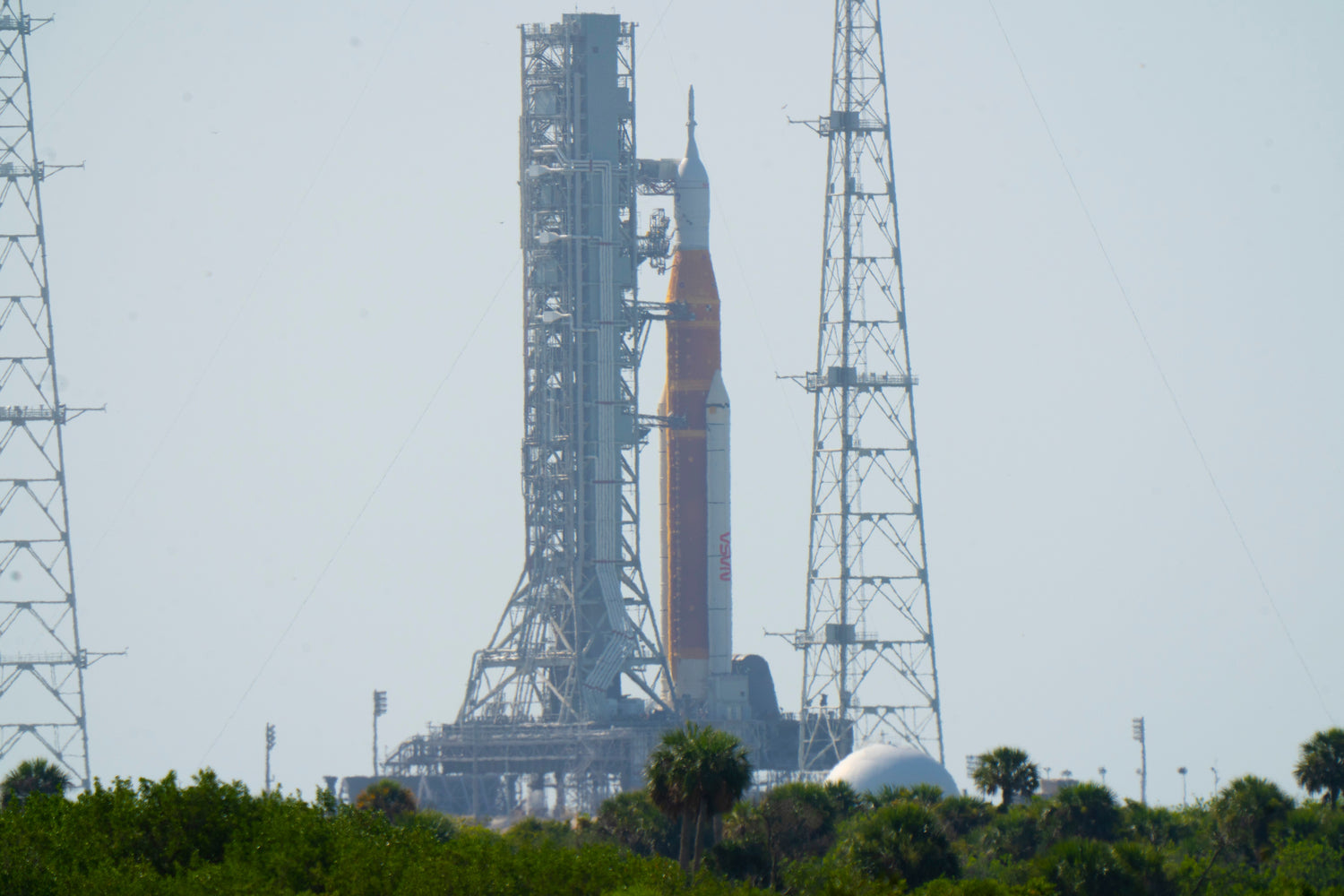 NASA's SLS rocket atop the mobile launcher platform along with the launch tower is in place at Launch Complex 39B.